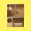 Modern wooden cat boarding suite with glass doors and circular entry, on yellow background